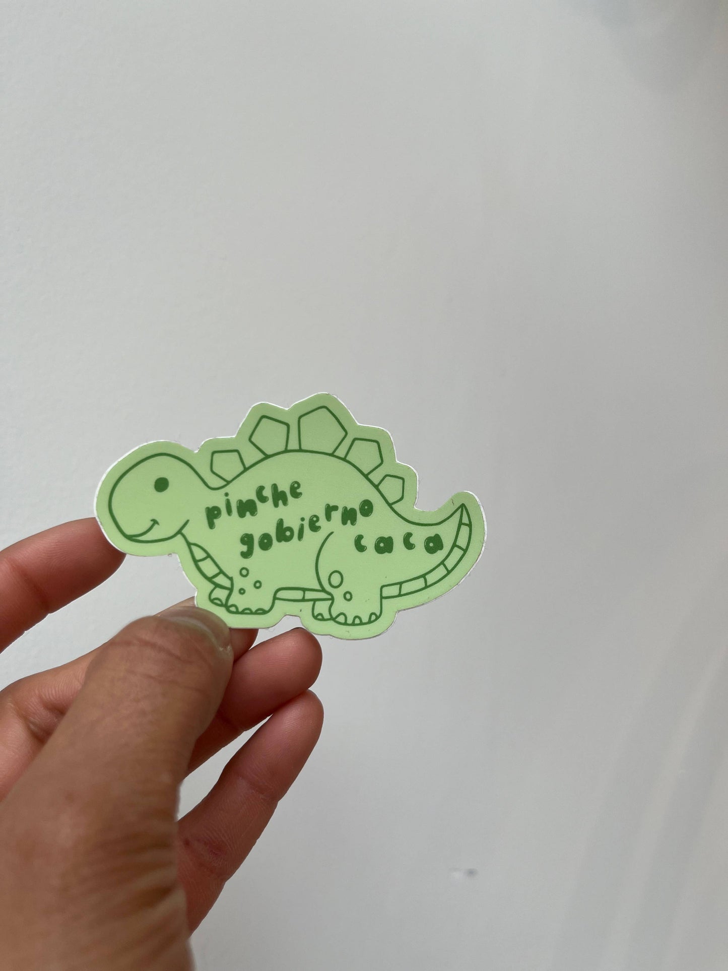 "Pinche Gobierno Caca" Dino Sticker by JZD